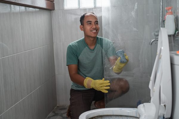 a-man-wearing-gloves-cleaned-the-toilet-glass-divi-2025-10-16-06-55-58-utc